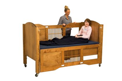 A young boy in the high side model of the dream series bed. 