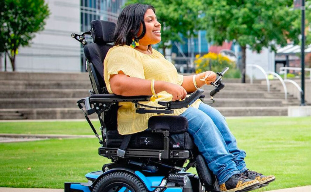 Young woman in power wheelchair