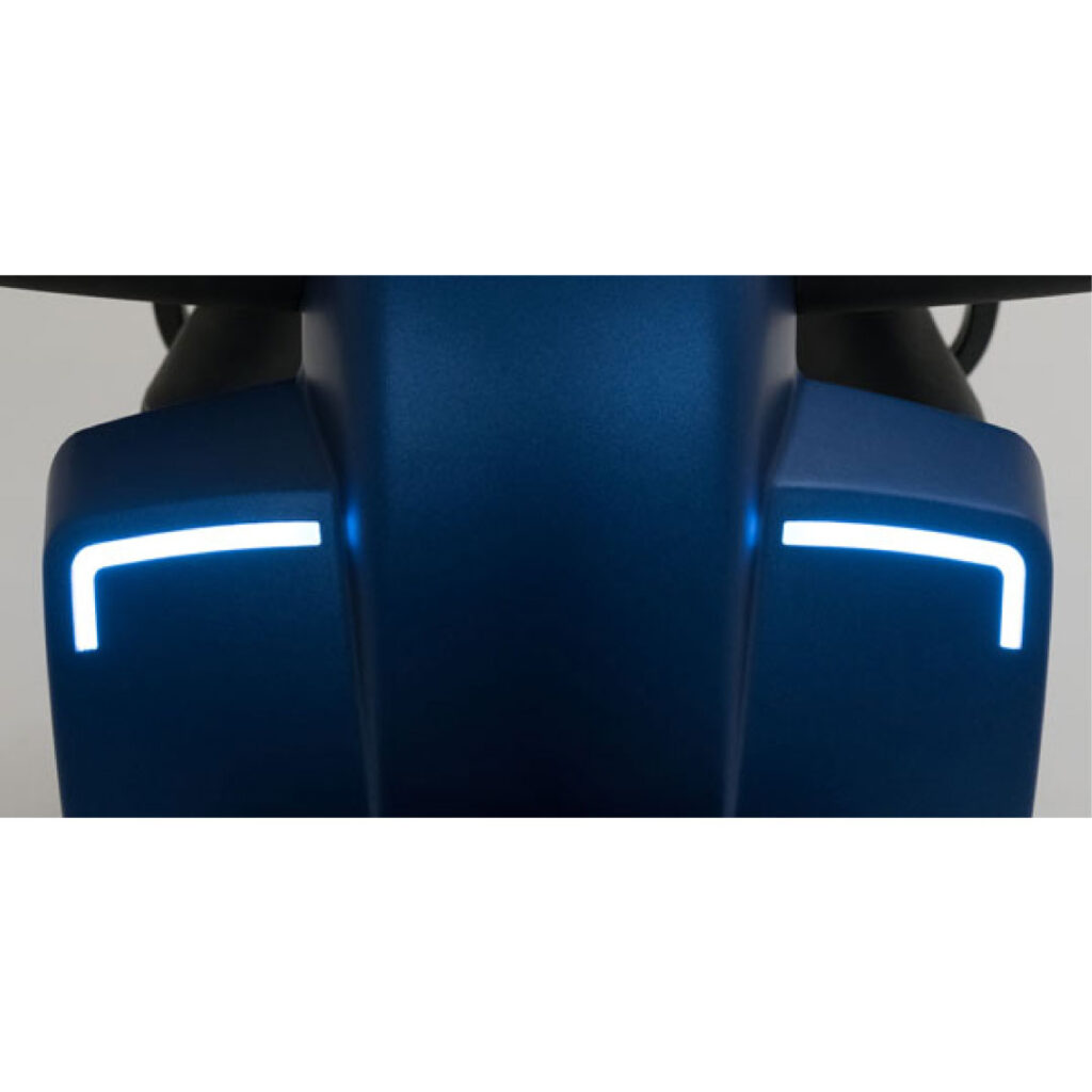 LED headlights are lit on a blue mobility scooter