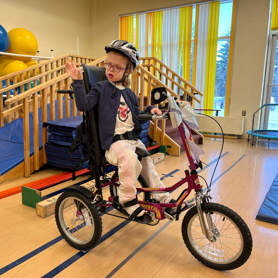 Anika in her new tricycle.