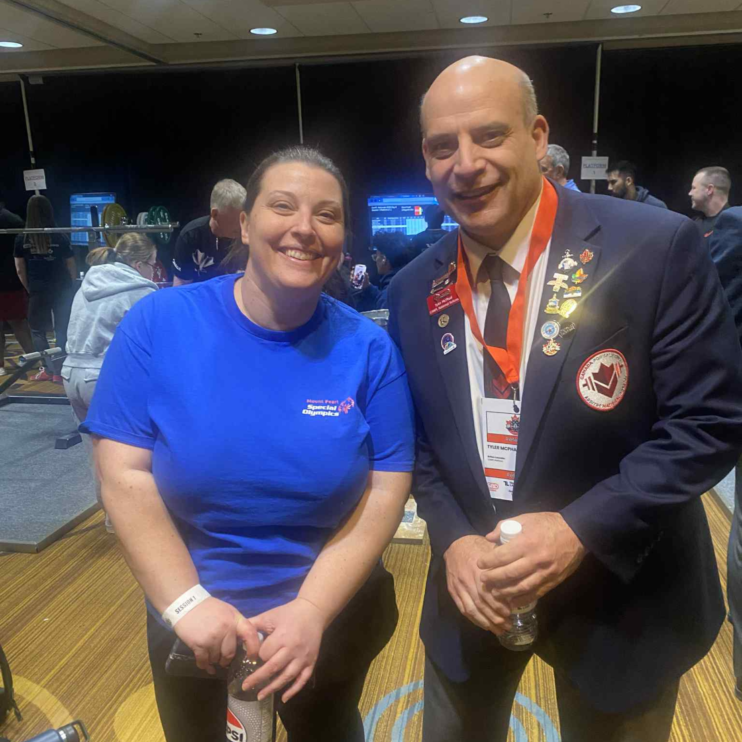 Tyler and a female special Olympian coach.