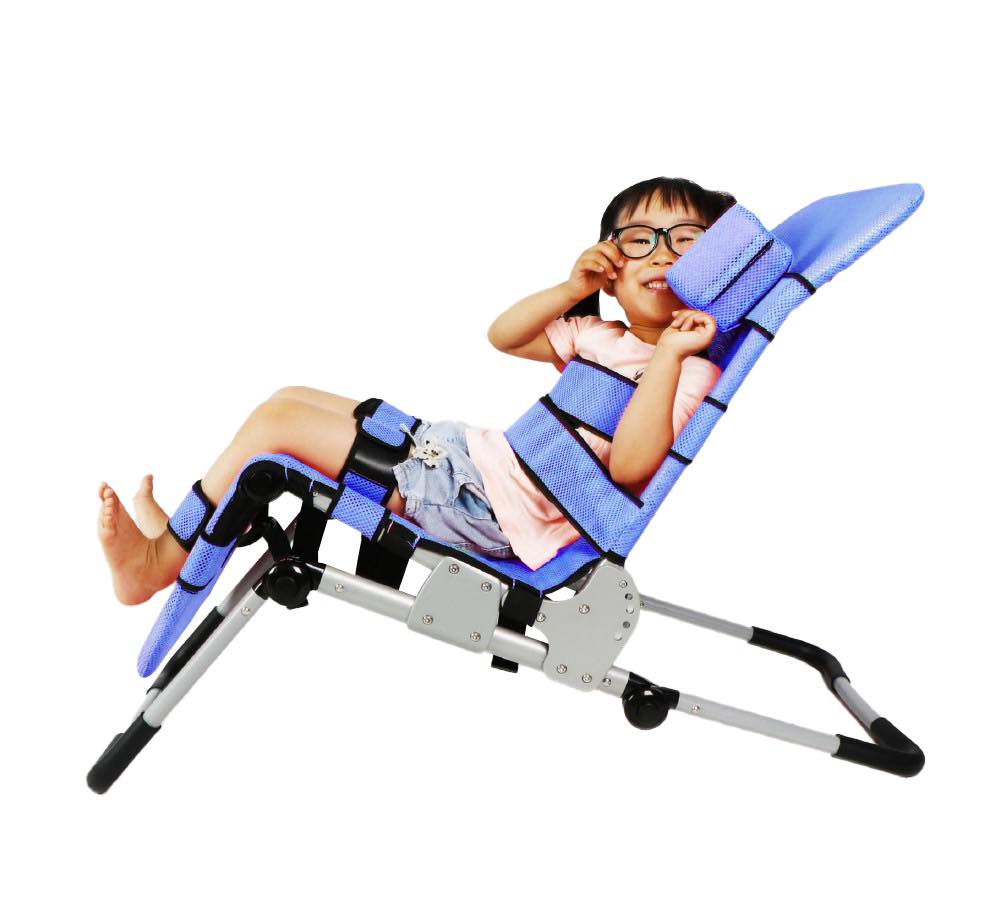 A young boy with glasses in the blue bath chair. 